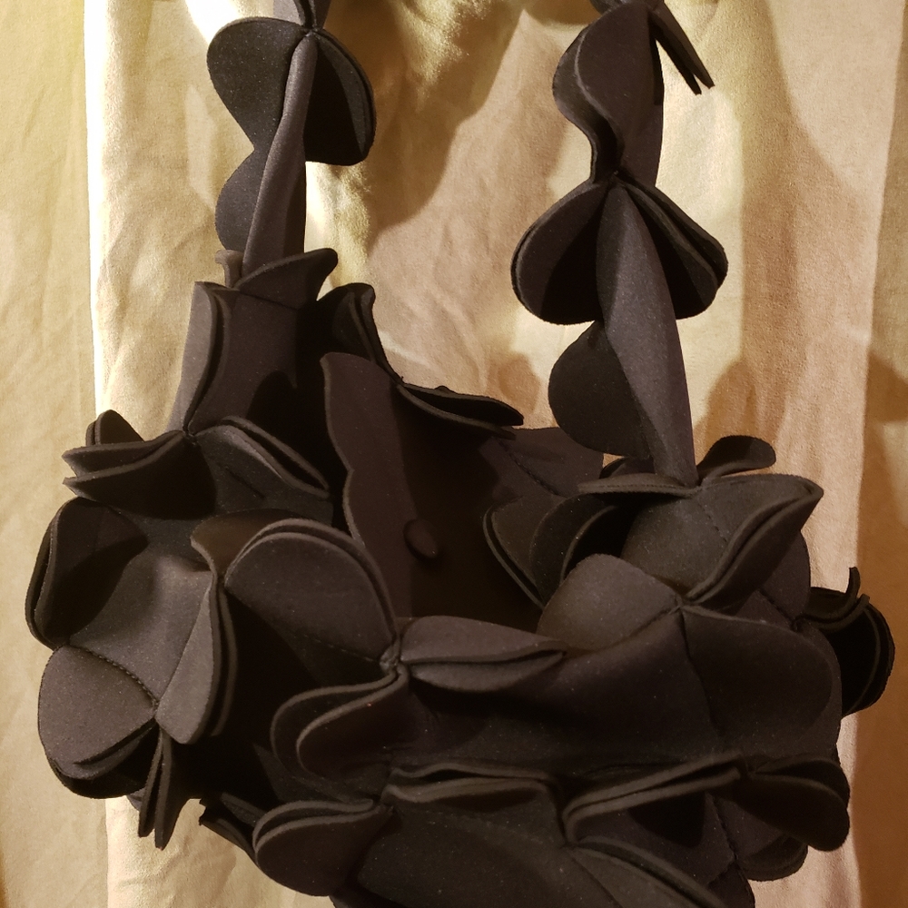 Unique petal handbag made out of neoprene material of soft cloth & long strap